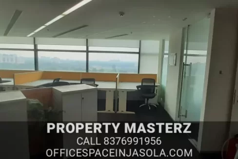 Modern glass-partitioned cabins in a tdi centre jasola office for rent.