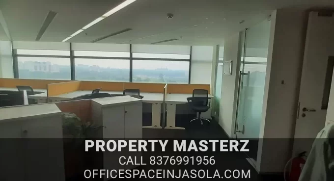 Modern glass-partitioned cabins in a tdi centre jasola office for rent.