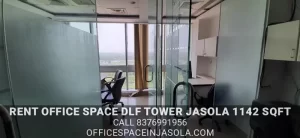 Private manager cabin inside a 1142 sqft office space for rent in DLF Tower Jasola with glass partitions.