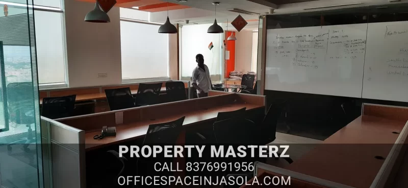 Exterior view of premium office space for rent in jasola with modern glass facade.