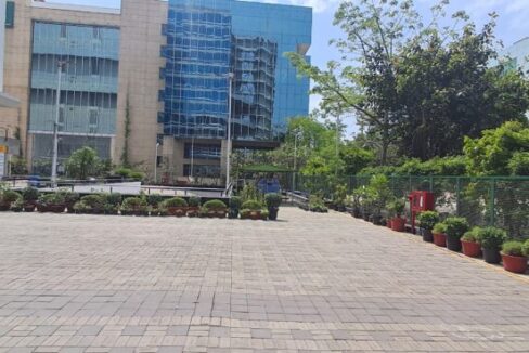 Corporate professionals walking near the Jasola Apollo Metro Station in South Delhi